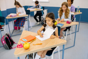 Children studying in classroom setting