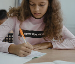Girl studying prime factorization