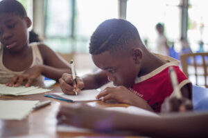 Young boy studying math