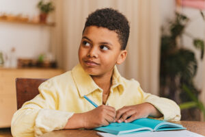 Young boy studying math at home