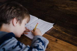 Young boy studying math