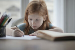 Young girl working on math problems