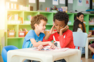 Boy helping friend with math