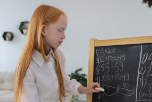 Girl working on math brain teasers
