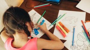 Girl coloring in