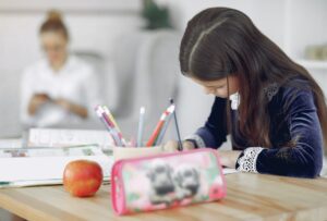 Girl writing in a notebook