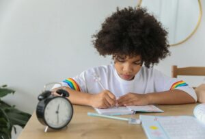 School kid writing in a diary