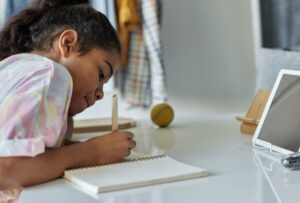 Child doing writing homework