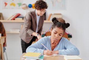Girl writing in class