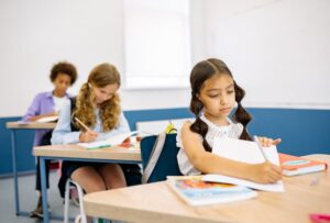 Students sitting at desks writing