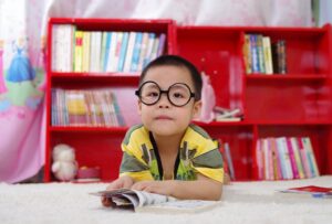 Young kid reading book