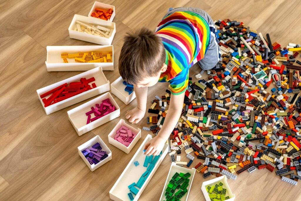Boy sorting legos